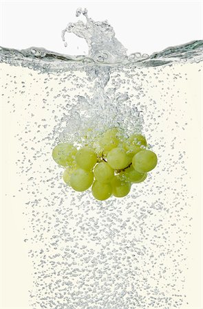 Grapes falling into champagne Stock Photo - Premium Royalty-Free, Code: 659-06183762