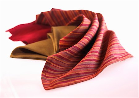 fabric napkin - Three Cloth Napkins on a White Background Stock Photo - Premium Royalty-Free, Code: 659-06183821