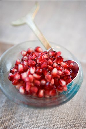 exotic fruit bowl - Pomegranate Seeds in a Small Bowl with Spoon Stock Photo - Premium Royalty-Free, Code: 659-06183895