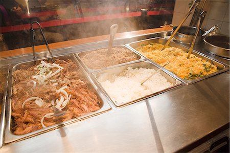 Trays if Pulled Pork and Rices; Steaming; Buffet Stock Photo - Premium Royalty-Free, Code: 659-06183893