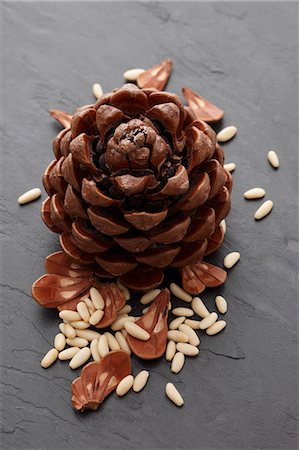 A pine cone and pine nuts Stock Photo - Premium Royalty-Free, Code: 659-06306539