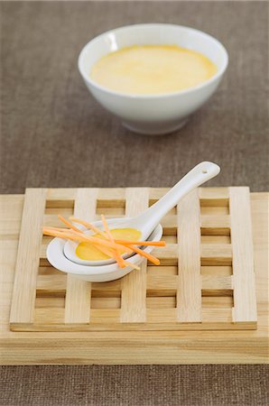 Carrot soup with carrot strips on an Oriental spoon Stock Photo - Premium Royalty-Free, Code: 659-06306583