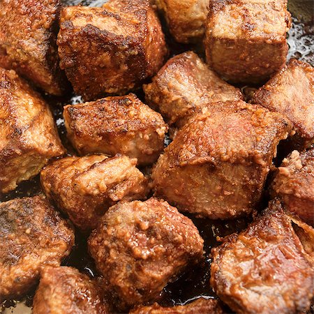 rezept (kochen) - Bräunung Grass Fed Rindsfilet-Tipps in einer Pfanne Stockbilder - Premium RF Lizenzfrei, Bildnummer: 659-06306592