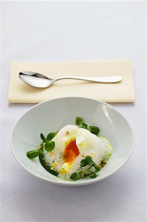 A poached egg on herb cream with watercress Stock Photo - Premium Royalty-Free, Code: 659-06306712