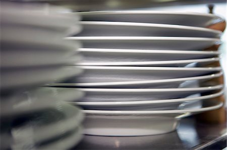 simsearch:659-01846629,k - A stack of plates in a commercial kitchen Stock Photo - Premium Royalty-Free, Code: 659-06306796