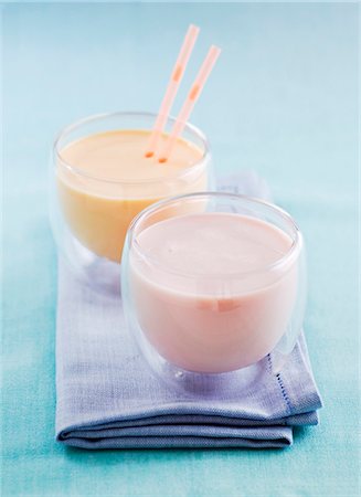 dairy products milkshakes - A strawberry drink and a mango lassi Stock Photo - Premium Royalty-Free, Code: 659-06306829