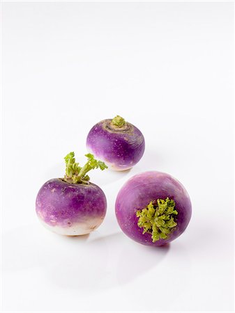 Three white turnips on a white surface Foto de stock - Sin royalties Premium, Código: 659-06306884