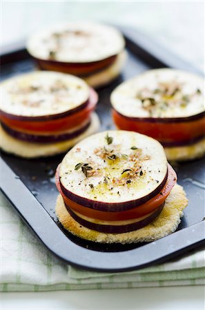 Cassava bread topped with spiced aubergine and tomato slices (Caribbean) Stock Photo - Premium Royalty-Free, Code: 659-06306996