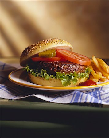 french fries - Hamburger with Lettuce, Tomato and Pickle, Fries Stock Photo - Premium Royalty-Free, Code: 659-06307041