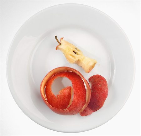 simsearch:659-06372353,k - An apple core and apple peel on a plate Stock Photo - Premium Royalty-Free, Code: 659-06307181