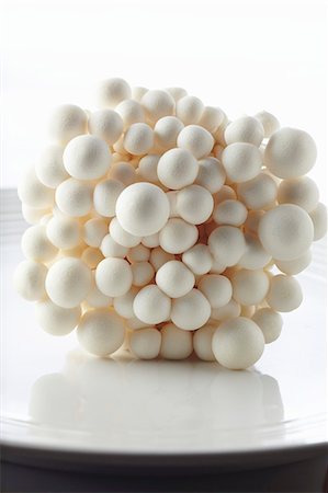 Fresh Bunch of White Beech Mushrooms; White Background Stock Photo - Premium Royalty-Free, Code: 659-06307191