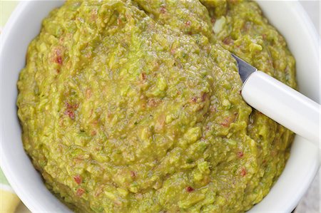 Bowl of Guacamole with a Spoon;From Above Stock Photo - Premium Royalty-Free, Code: 659-06307213