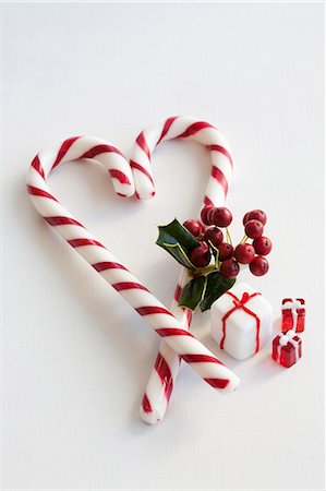 sugar candy - A candy cane heart with holly and glass decorations Stock Photo - Premium Royalty-Free, Code: 659-06307383