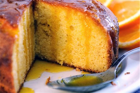 simsearch:659-06372380,k - Sliced semolina cake with orange syrup (close-up) Stock Photo - Premium Royalty-Free, Code: 659-06307580