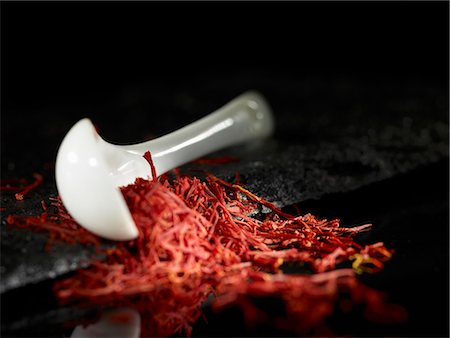 spices black background - Saffron threads and a spoon Stock Photo - Premium Royalty-Free, Code: 659-06307627