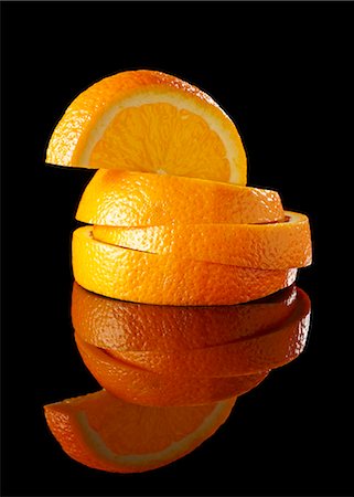 food pictures with black background images - A stack of orange slices Stock Photo - Premium Royalty-Free, Code: 659-06307685