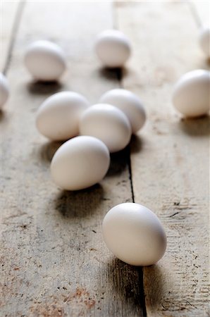 simsearch:659-06152780,k - White eggs on a wooden surface Stock Photo - Premium Royalty-Free, Code: 659-06307774