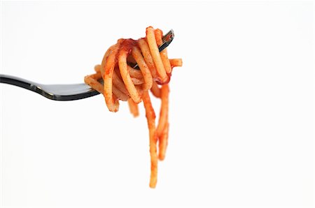 pasta - A fork of spaghetti with tomato sauce Foto de stock - Sin royalties Premium, Código: 659-06307836