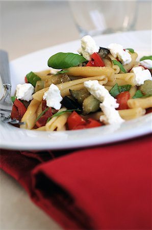 eggplant recipe - Pasta with aubergines, tomatoes and ricotta Stock Photo - Premium Royalty-Free, Code: 659-06307838