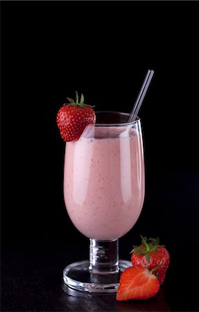 strawberry milkshake - A strawberry smoothie with fresh strawberries Stock Photo - Premium Royalty-Free, Code: 659-06307887