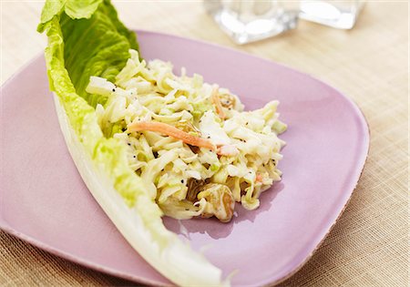 Coleslaw with Golden Raisins and a Lettuce Leaf Stock Photo - Premium Royalty-Free, Code: 659-06372389