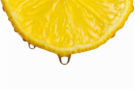 A dripping lemon slice Foto de stock - Sin royalties Premium, Código: 659-06372424