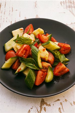 simsearch:659-03523047,k - Tomato and cucumber salad with pineapple and basil Stock Photo - Premium Royalty-Free, Code: 659-06372536