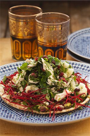 food of africa - Chicken salad with parsley and pomegranate seeds on unleavened bread Stock Photo - Premium Royalty-Free, Code: 659-06372538