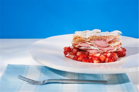 soft fruit dessert - Strawberry mousse in puff pastry on balsamic strawberries Stock Photo - Premium Royalty-Free, Code: 659-06372620