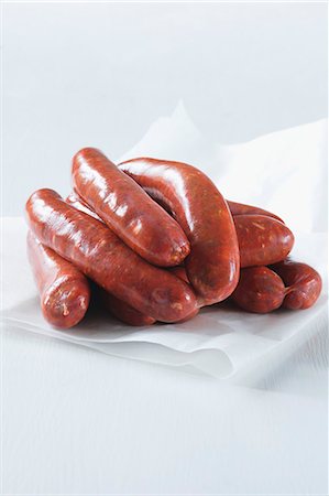 debreziner - Debrecener sausages on a piece of paper Stock Photo - Premium Royalty-Free, Code: 659-06372810