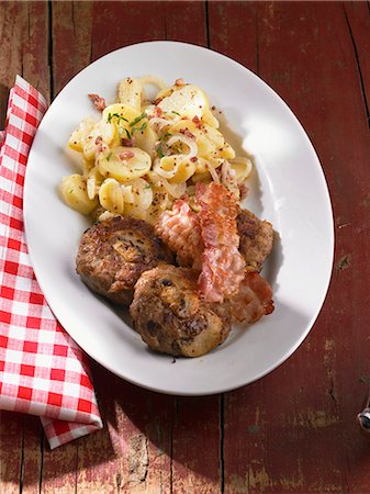 simsearch:659-06671239,k - Meat balls with mushrooms, bacon and potato salad Stock Photo - Premium Royalty-Free, Code: 659-06372874