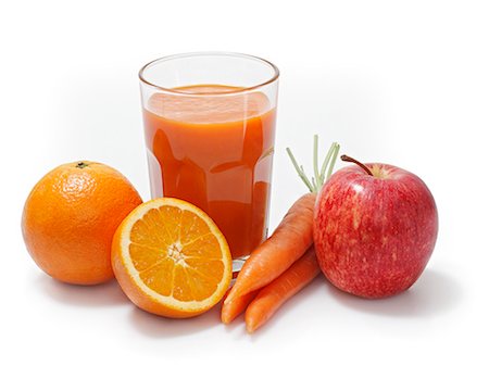 Multi-vitamin juice surrounded by oranges, apples and carrots Stock Photo - Premium Royalty-Free, Code: 659-06373009