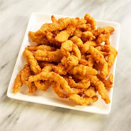 frying pan - Fried Clam Strips on a White Dish Foto de stock - Sin royalties Premium, Código: 659-06373057