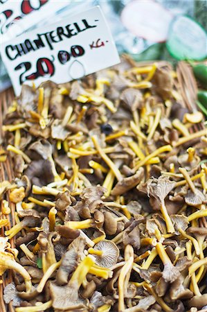 simsearch:659-06152980,k - Fresh chanterelle mushrooms at a market Stock Photo - Premium Royalty-Free, Code: 659-06373359