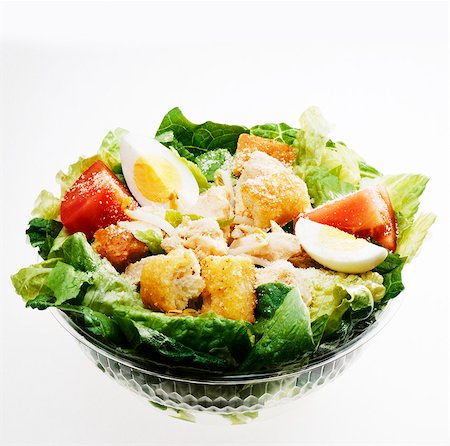Fast Food Chicken Caesar Salad in a Plastic Container; White Bowl Stock Photo - Premium Royalty-Free, Code: 659-06373497