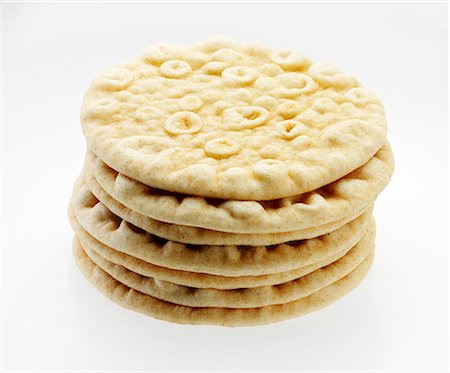 Stack of Pita Breads on a White Background Stock Photo - Premium Royalty-Free, Code: 659-06373493