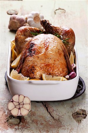 poulet - Roast chicken with lemons, garlic and rosemary Stock Photo - Premium Royalty-Free, Code: 659-06373641