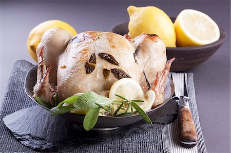 Roast chicken with sage and lemons Stock Photo - Premium Royalty-Free, Code: 659-06373642
