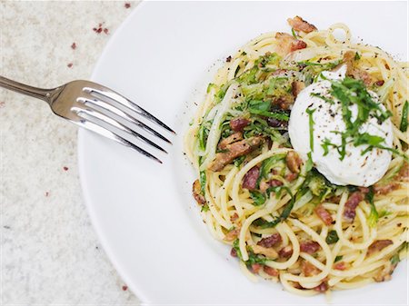 pasta dish - Spaghetti carbonara with a poached egg and herbs Stock Photo - Premium Royalty-Free, Code: 659-06373757