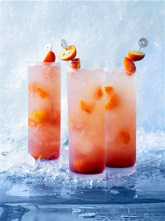 Asian Sling cocktails with kumquats and orange juice Stock Photo - Premium Royalty-Free, Code: 659-06373865