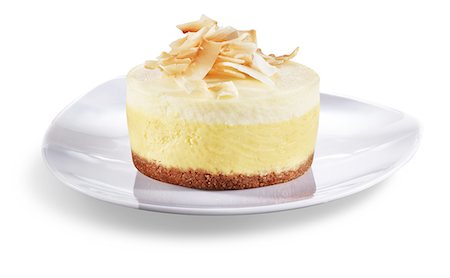 simsearch:659-06151397,k - Mango Citrus Cheesecake with Toasted Coconut; White Background Stock Photo - Premium Royalty-Free, Code: 659-06494108
