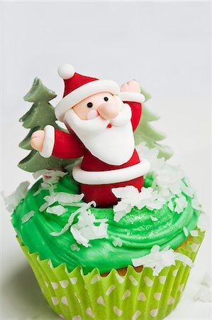 A cupcake decorated with a Father Christmas figure Stock Photo - Premium Royalty-Free, Code: 659-06494280