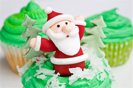 A cupcake decorated with a Father Christmas figure Stock Photo - Premium Royalty-Free, Code: 659-06494281