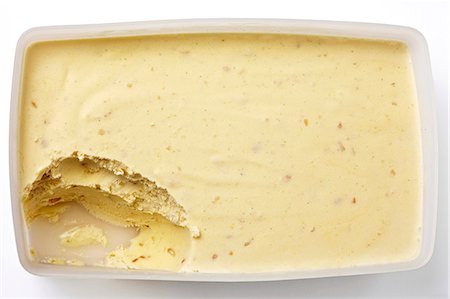 pudding above - A tub of peanut butter with a scoop taken out Stock Photo - Premium Royalty-Free, Code: 659-06494430