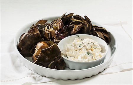 Artichokes with a garlic dip Stock Photo - Premium Royalty-Free, Code: 659-06494556