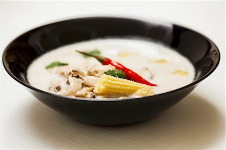 south east asian cooking - Tom ka gai (Thai chicken and coconut soup) Stock Photo - Premium Royalty-Free, Code: 659-06494563