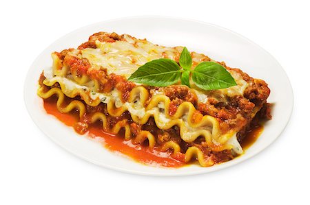 food plate isolated - Serving of Lasagna with Meat Sauce and Cheese; White Background Stock Photo - Premium Royalty-Free, Code: 659-06494703