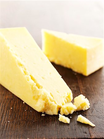 Slices of Cheddar cheese Stock Photo - Premium Royalty-Free, Code: 659-06494722