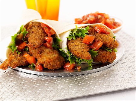 simsearch:659-03528432,k - Breaded chicken fillets and tomato salsa wraps Stock Photo - Premium Royalty-Free, Code: 659-06494736