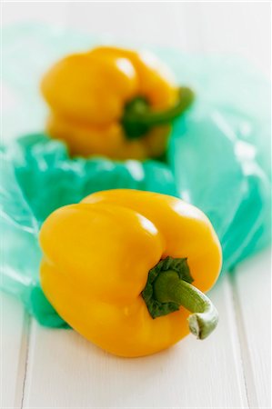 Yellow peppers on a plastic bag Stock Photo - Premium Royalty-Free, Code: 659-06494848